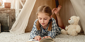 Kaip paskatinti vaiką skaityti knygas?